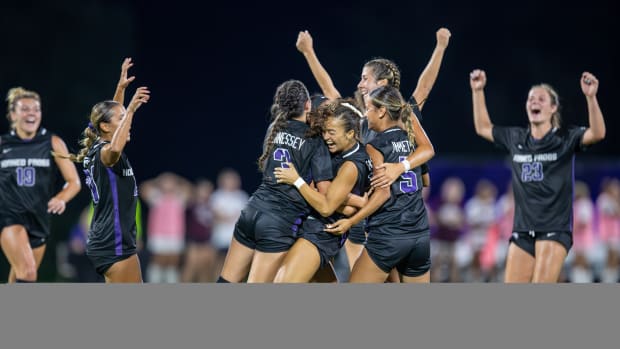 The Horned Frogs celebrate Seven Castain's game-winning goal in the 87th minute.